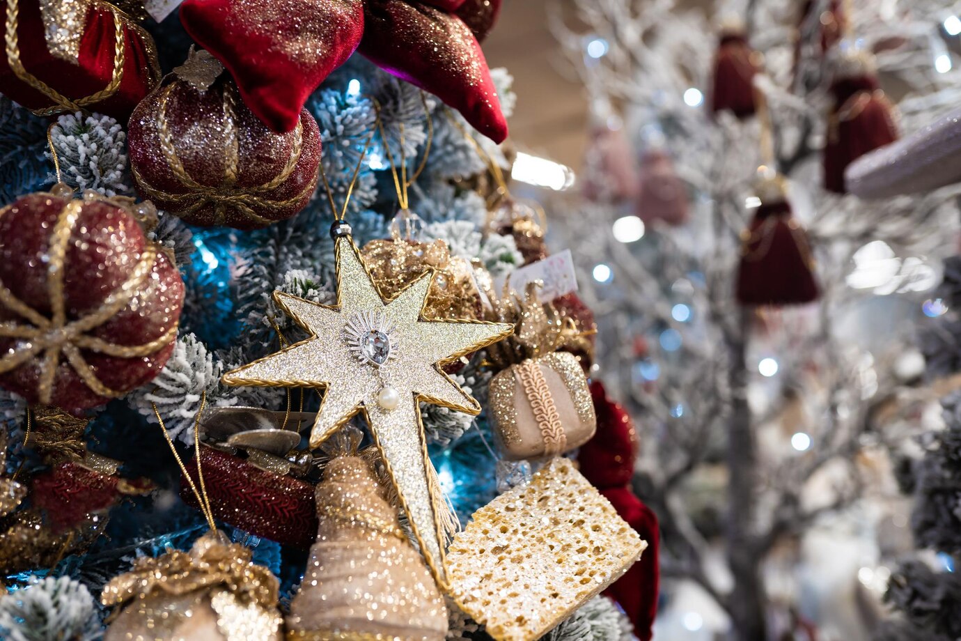 close_up_of_different_object_toy_gifts_hanging_on_a_decorated_christmas.jpg