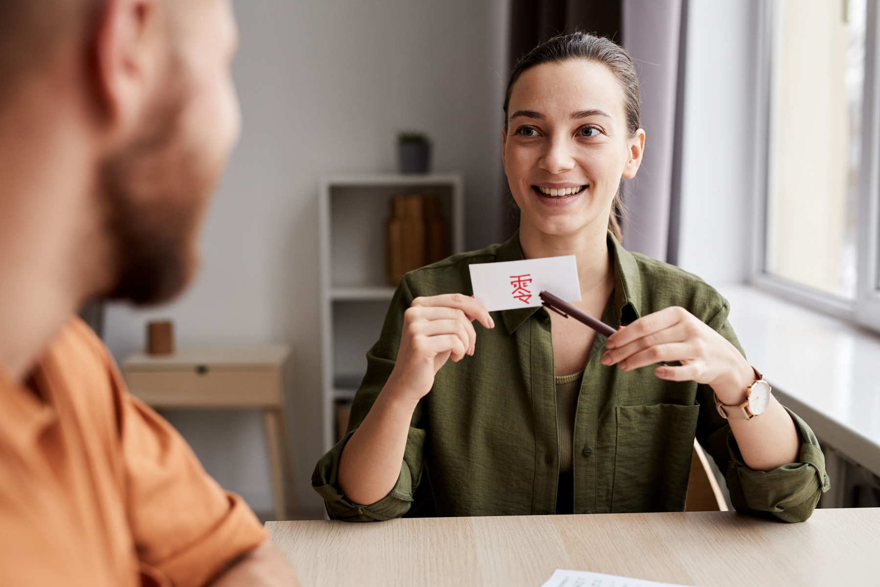 young-smiling-female-tutor-pointing-at-paper-card-2022-12-01-05-29-46-utc.jpg young-smiling-female-tutor-pointing-at-paper-card-2022-12-01-05-29-46-utc.jpg