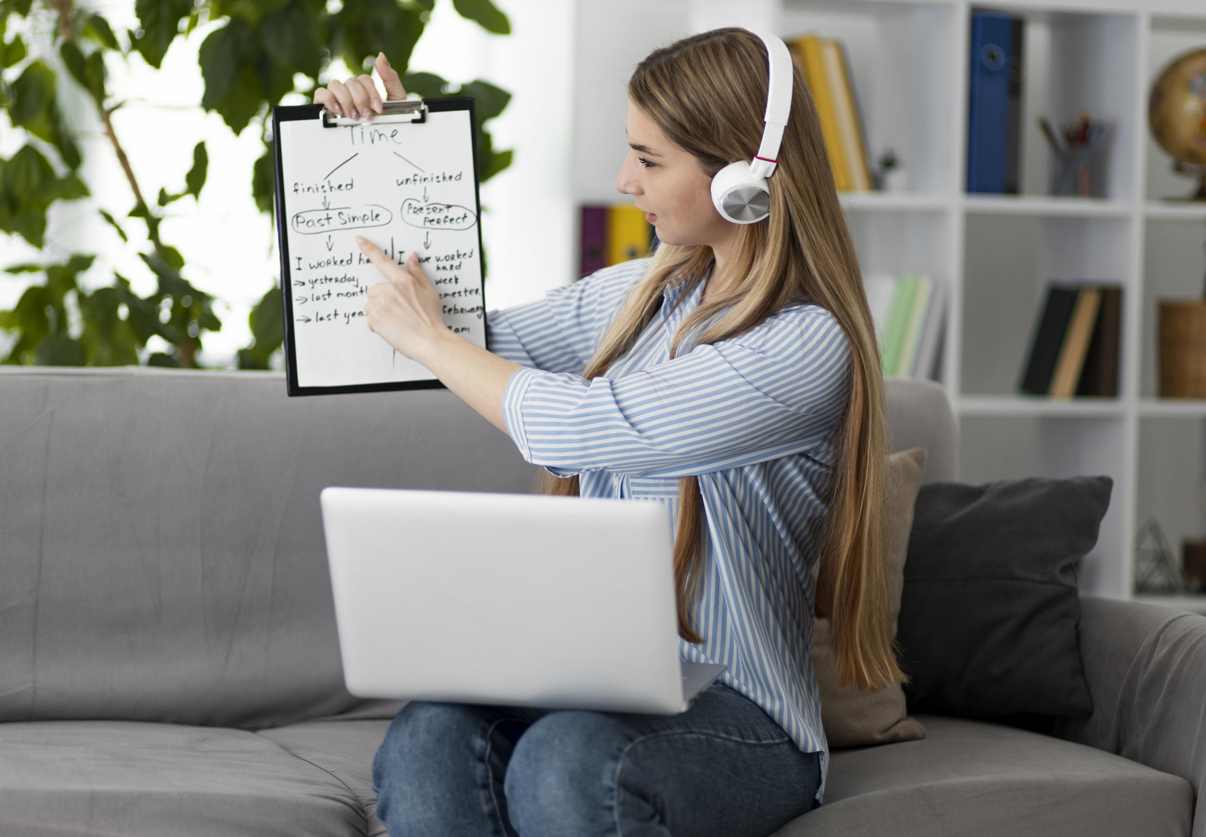 young-woman-teaching-kids-english-class-online.jpg
